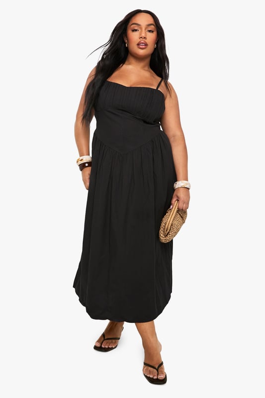 Crafted from breathable cotton poplin fabric for all-day comfort
        Elegant square neckline with adjustable spaghetti straps
        Empire waistline creates a flattering silhouette
        Flowing maxi length with relaxed skirt for effortless movement
        Versatile design perfect for warm-weather styling
    
    This breezy cotton maxi dress combines comfort with casual sophistication. The square neckline and empire waist create a feminine shape that flatters your curves, while the flowing skirt offers graceful movement with every step. Style with flat sandals and a woven clutch for daytime gatherings, or dress it up with layered bangles and statement earrings for evening drinks. The adjustable straps ensure a customised fit, making this an essential addition to your warm-weather wardrobe. Perfect for family barbecues, beach holidays, or weekend brunches, this Boohoo dress delivers effortless style for the fashion-forward woman who values both comfort and trend-conscious design. Pair with a denim jacket for cooler evenings or wear alone to showcase its simple elegance.
