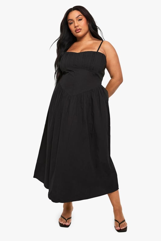Crafted from breathable cotton poplin fabric for all-day comfort
        Elegant square neckline with adjustable spaghetti straps
        Empire waistline creates a flattering silhouette
        Flowing maxi length with relaxed skirt for effortless movement
        Versatile design perfect for warm-weather styling
    
    This breezy cotton maxi dress combines comfort with casual sophistication. The square neckline and empire waist create a feminine shape that flatters your curves, while the flowing skirt offers graceful movement with every step. Style with flat sandals and a woven clutch for daytime gatherings, or dress it up with layered bangles and statement earrings for evening drinks. The adjustable straps ensure a customised fit, making this an essential addition to your warm-weather wardrobe. Perfect for family barbecues, beach holidays, or weekend brunches, this Boohoo dress delivers effortless style for the fashion-forward woman who values both comfort and trend-conscious design. Pair with a denim jacket for cooler evenings or wear alone to showcase its simple elegance.