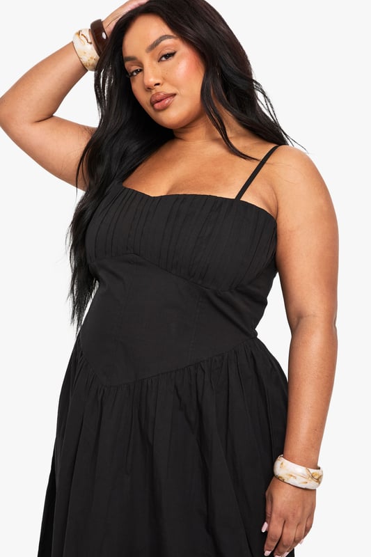 Crafted from breathable cotton poplin fabric for all-day comfort
        Elegant square neckline with adjustable spaghetti straps
        Empire waistline creates a flattering silhouette
        Flowing maxi length with relaxed skirt for effortless movement
        Versatile design perfect for warm-weather styling
    
    This breezy cotton maxi dress combines comfort with casual sophistication. The square neckline and empire waist create a feminine shape that flatters your curves, while the flowing skirt offers graceful movement with every step. Style with flat sandals and a woven clutch for daytime gatherings, or dress it up with layered bangles and statement earrings for evening drinks. The adjustable straps ensure a customised fit, making this an essential addition to your warm-weather wardrobe. Perfect for family barbecues, beach holidays, or weekend brunches, this Boohoo dress delivers effortless style for the fashion-forward woman who values both comfort and trend-conscious design. Pair with a denim jacket for cooler evenings or wear alone to showcase its simple elegance.