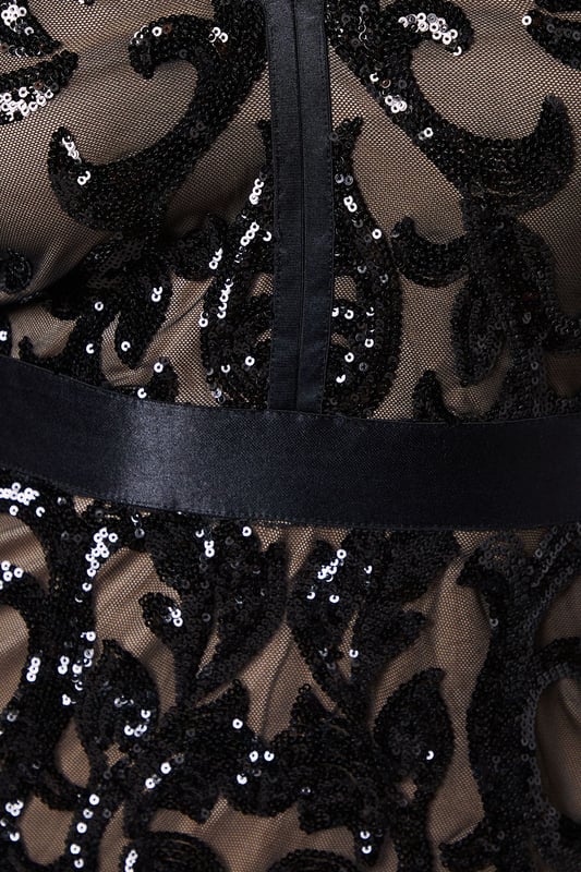 Striking sequin embellishment across intricate pattern detailing
        Elegant V-neckline frames the dcolletage beautifully
        Figure-enhancing maxi silhouette with floor-sweeping length
        Long sleeves offer sophisticated coverage for formal occasions
        Semi-sheer overlay creates a captivating contrast against the lining
    
    Make an unforgettable entrance in this show-stopping sequin maxi dress from Coast. The alluring V-neckline and body-contouring fit create a silhouette that commands attention, whilst the intricate pattern detailing adds depth and dimension to your look. Perfect for black-tie events, evening galas or wedding receptions, this dress requires minimal accessorising-simply pair with delicate drop earrings and a sleek clutch as seen on our model. The floor-length design creates a graceful sweep as you move, whilst the long sleeves provide an elegant balance to the striking neckline. Style with strappy heeled sandals and a tailored evening coat for cooler evenings. This dress transitions effortlessly from formal ceremonies to evening celebrations, ensuring you remain the epitome of sophistication throughout any special occasion.