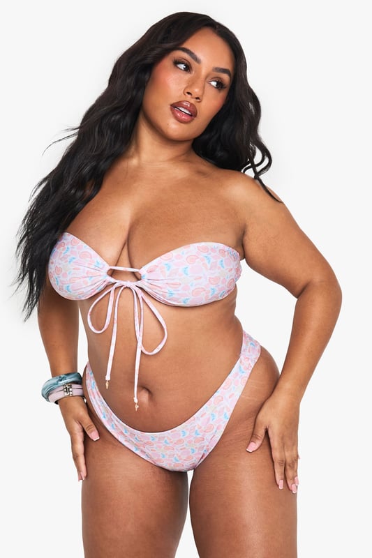 High-waisted bikini bottoms featuring an eye-catching shell print design
        Comfortable elasticated waistband for a secure fit during beach activities
        Flattering cut that provides good coverage whilst maintaining a fashionable silhouette
        Pairs perfectly with the matching bandeau top for a coordinated swimwear look
        Available in plus sizes, designed to celebrate and flatter curves
    
    Make waves this season with these striking high-waisted bikini bottoms from Boohoo. The charming shell print adds a playful touch to your beach ensemble, whilst the high-waisted design offers both comfort and confidence. Style with the coordinating bandeau top for a complete look that's perfect for poolside lounging or coastal adventures. For a casual beach day, throw on a loose linen shirt and oversized sunglasses, or pair with a flowing kimono and sandals for beachside lunch dates. These versatile bottoms can also be mixed with a plain top from your collection for a personalised twist. Ideal for family holidays, festival pool parties or simply soaking up the sun in the garden, these bikini bottoms are a must-have addition to your summer wardrobe.