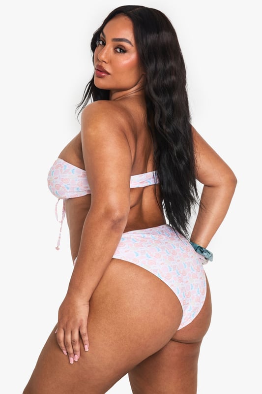High-waisted bikini bottoms featuring an eye-catching shell print design
        Comfortable elasticated waistband for a secure fit during beach activities
        Flattering cut that provides good coverage whilst maintaining a fashionable silhouette
        Pairs perfectly with the matching bandeau top for a coordinated swimwear look
        Available in plus sizes, designed to celebrate and flatter curves
    
    Make waves this season with these striking high-waisted bikini bottoms from Boohoo. The charming shell print adds a playful touch to your beach ensemble, whilst the high-waisted design offers both comfort and confidence. Style with the coordinating bandeau top for a complete look that's perfect for poolside lounging or coastal adventures. For a casual beach day, throw on a loose linen shirt and oversized sunglasses, or pair with a flowing kimono and sandals for beachside lunch dates. These versatile bottoms can also be mixed with a plain top from your collection for a personalised twist. Ideal for family holidays, festival pool parties or simply soaking up the sun in the garden, these bikini bottoms are a must-have addition to your summer wardrobe.