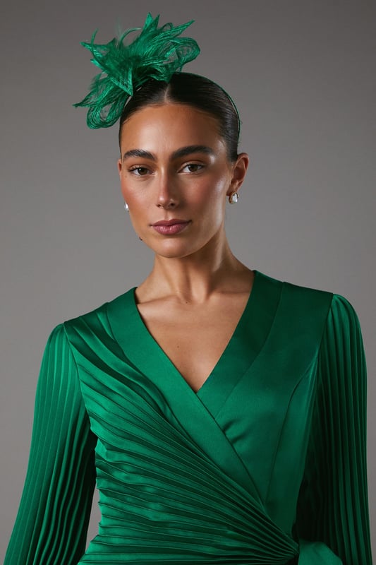 Exquisite open weave design with delicate bow and feather detailing
Lightweight and airy fascinator crafted from fancy fabric
Headpiece features a slender, curved headband for a secure fit
Intricate weave pattern creates a captivating textural effect
Versatile accessory to elevate your ensemble for formal occasions

Radiate sophistication and elegance with this stunning fascinator from Coast. The open weave design, adorned with a delicate bow and feather embellishments, exudes a refined and feminine aesthetic. Crafted from a lightweight and airy fancy fabric, this headpiece is the perfect accompaniment to your formal attire, whether you're attending a wedding, the races, or a graduation ceremony. Its slender, curved headband ensures a secure and comfortable fit, allowing you to confidently embrace the occasion. Style this versatile fascinator with a tailored dress or a chic jumpsuit for a polished and sophisticated look that commands attention.