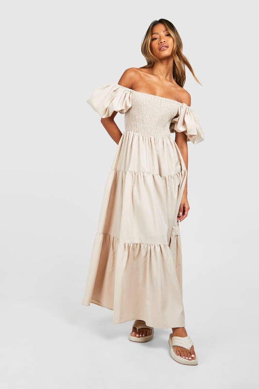 Hit refresh on your dress collection with a new-in smock dress. The much-loved 1920s style is back for the new season, with its breezy silhouette and frill detailing. A women's smock dress is the perfect transitional piece that looks unreal every season. Go from the office to out-out in a black smock dress, pair it with some killer heels and you're good to go. Spend your summer days in a dreamy tiered smock dress - the floaty, free-moving fabric is perfect for staying cool. From feminine florals to statement prints, this loose-fitting dress is just what you need. Shop everything from timeless white smock dresses to trending gingham styles, on boohoo.Style: Smock DressFabric: Woven CrepeLength: MidaxiSleeve Length: Short Sleeve