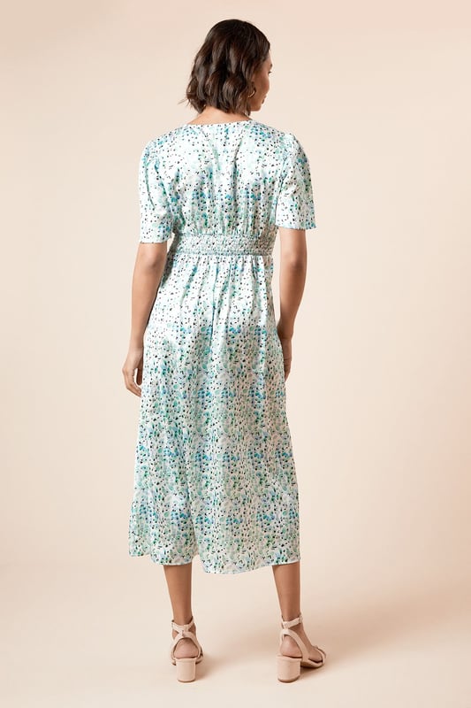 Elegant V-neckline complemented by feminine angel sleeves for a soft, fluttery silhouette
        Midi length design offering sophisticated coverage whilst maintaining a contemporary feel
        Delicate all-over print that adds visual interest to this versatile piece
        Flattering cinched waist detail that creates a beautifully defined silhouette
        Lightweight woven fabric ensuring comfort and ease of movement throughout the day
    
    This charming midi dress from Dorothy Perkins strikes the perfect balance between casual comfort and refined style. The graceful angel sleeves create a soft, feminine frame whilst the V-neckline adds a touch of subtle allure. The cinched waist design gently defines your silhouette, flowing into an elegant midi length that's both practical and stylish. Perfect for casual gatherings, this dress pairs beautifully with flat sandals and a woven tote for weekend brunches with friends. For baby showers or family celebrations, style with block-heeled sandals and delicate jewellery for a polished finish. The versatile design transitions effortlessly from daytime casual to evening drinks - simply swap your flats for ankle boots and add a cropped denim jacket as temperatures cool. Machine washable for easy care, this dress promises to become a cherished staple in your wardrobe.