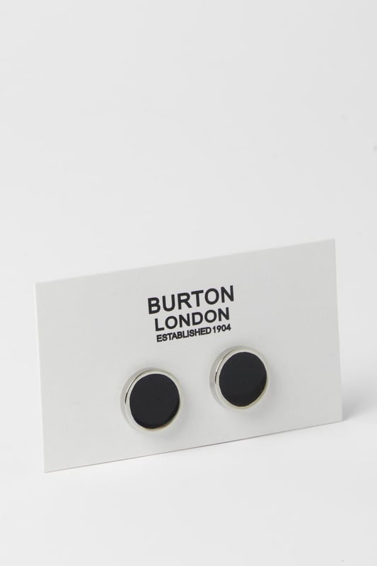 Sleek circular design with contrasting black centre and polished silver rim
        Secure toggle fastening for reliable wear throughout the day
        Versatile size that complements both standard and French cuffs
        Classic Burton craftsmanship with attention to detail
        Timeless monochrome palette that pairs with any formal shirt
    
    These sophisticated cufflinks offer the perfect finishing touch to your formal attire. The striking contrast between the black centre and silver surround creates a refined aesthetic that works brilliantly with a range of shirt colours. Ideal for adding a subtle touch of personality to your suit, these cufflinks can be styled with a crisp white shirt and navy blazer for important meetings, or paired with a grey suit for wedding celebrations. The understated design makes them appropriate for various smart occasions, from business functions to evening events. For a complete look, match with a silver-toned watch and a classic Burton suit. These cufflinks reflect a man who appreciates traditional style with contemporary appeal - perfect for the gentleman who values both function and form in his accessories.