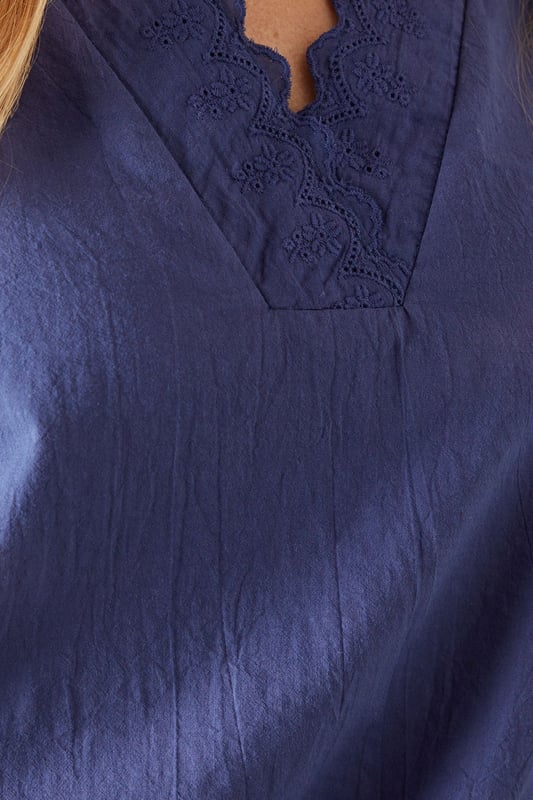 Elegant V-neckline with delicate ruffle trim detailing
        Relaxed overhead design for effortless styling
        Soft cotton fabric ensures all-day comfort
        Versatile three-quarter length balloon sleeves
        Flattering petite fit, perfect for smaller frames
    
    This charming Wallis ruffle overhead shirt combines sophisticated style with everyday comfort. The delicate ruffle trim along the V-neckline adds a feminine touch to this versatile piece, while the relaxed silhouette ensures a flattering fit for various body types. Style it as shown with wide-leg denim and trainers for casual weekend brunches, or tuck it into tailored trousers with ballet flats for family gatherings. The lightweight cotton construction makes it ideal for layering under cardigans during cooler months or wearing alone during warmer days. Perfect for daytime occasions when you want to look polished yet comfortable, this shirt will quickly become a wardrobe staple that transitions seamlessly from shopping trips to casual lunch dates with friends.