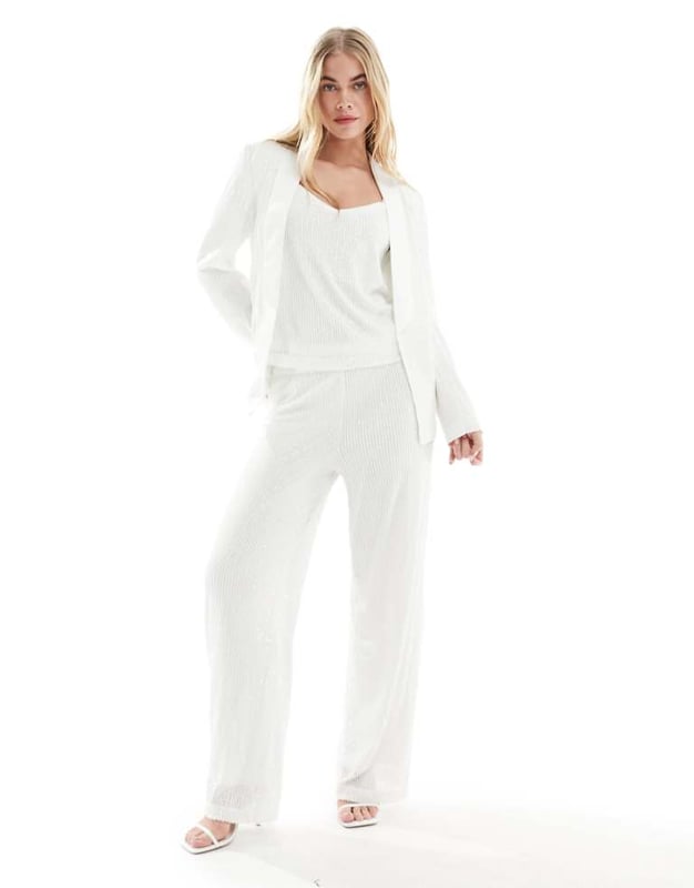 Trousers & Leggings by Vila Part of a co-ord set Top and blazer sold separately Sequin embellishment High rise Elasticated waist Wide legSold By: Asos