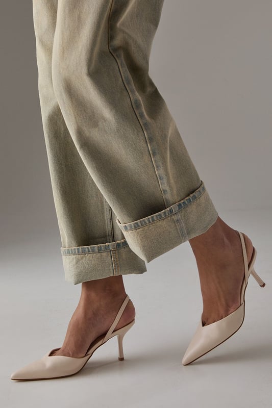 Elegant slingback design with secure ankle strap for comfortable all-day wear
        Pointed toe silhouette creates a flattering, leg-lengthening effect
        Sleek high stiletto heel measuring between 7-9cm adds sophisticated height
        Smooth faux leather finish offers a polished, versatile appearance
        Cushioned footbed provides essential comfort without compromising on style
    
    The Faith Dottie court shoes strike the perfect balance between contemporary design and timeless appeal. The pointed toe and slingback silhouette create a refined shape that complements both casual and smart-casual ensembles. Style these versatile heels with relaxed denim and a floaty blouse for family gatherings, or pair with tailored trousers for an elevated daytime look. The 7-9cm stiletto heel offers just the right amount of height whilst remaining appropriate for everyday occasions. The secure slingback strap ensures these courts stay comfortably in place throughout the day, making them ideal for shopping trips or casual lunches with friends. Their clean lines and sophisticated shape make them a wardrobe essential that will complement numerous outfits in your collection, offering endless styling possibilities for daywear occasions.