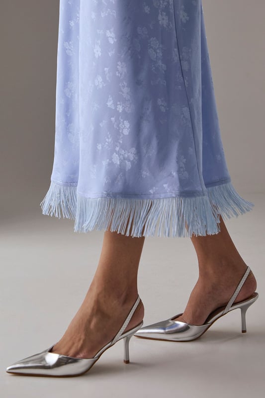 Elegant slingback design with secure ankle strap for comfortable all-day wear
        Pointed toe silhouette creates a flattering, leg-lengthening effect
        Sleek high stiletto heel measuring between 7-9cm adds sophisticated height
        Smooth faux leather finish offers a polished, versatile appearance
        Cushioned footbed provides essential comfort without compromising on style
    
    The Faith Dottie court shoes strike the perfect balance between contemporary design and timeless appeal. The pointed toe and slingback silhouette create a refined shape that complements both casual and smart-casual ensembles. Style these versatile heels with relaxed denim and a floaty blouse for family gatherings, or pair with tailored trousers for an elevated daytime look. The 7-9cm stiletto heel offers just the right amount of height whilst remaining appropriate for everyday occasions. The secure slingback strap ensures these courts stay comfortably in place throughout the day, making them ideal for shopping trips or casual lunches with friends. Their clean lines and sophisticated shape make them a wardrobe essential that will complement numerous outfits in your collection, offering endless styling possibilities for daywear occasions.