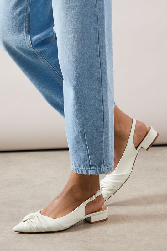 Elegant pointed toe design with sophisticated twist detail at the front
        Comfortable low heel measuring between 2.5-4.5cm for all-day wearability
        Adjustable slingback strap with buckle fastening for a secure fit
        Faux leather finish offering a polished, sophisticated appearance
        Versatile silhouette that pairs beautifully with both trousers and dresses
    
    These sophisticated slingbacks strike the perfect balance between style and comfort. The elegant pointed toe and distinctive twist detail create a refined silhouette, whilst the practical low heel ensures you can wear them from morning to evening without discomfort. Style them with rolled-up jeans for a casual daytime look that still conveys sophistication, or pair with tailored trousers and a crisp white shirt for family gatherings or lunch dates. The adjustable slingback design offers both security and a touch of feminine charm, making these shoes a versatile addition to your wardrobe. Their timeless appeal works wonderfully for various daywear occasions, from shopping trips to casual office environments. The sleek design ensures they'll complement virtually any outfit, making them a reliable go-to when you want to look effortlessly put-together without sacrificing comfort.