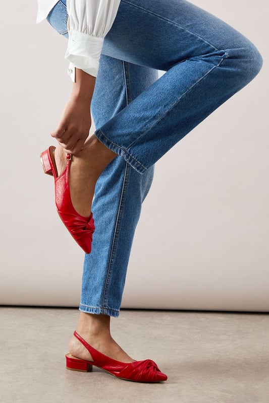 Elegant pointed toe design with sophisticated twist detail at the front
        Comfortable low heel measuring between 2.5-4.5cm for all-day wearability
        Adjustable slingback strap with buckle fastening for a secure fit
        Faux leather finish offering a polished, sophisticated appearance
        Versatile silhouette that pairs beautifully with both trousers and dresses
    
    These sophisticated slingbacks strike the perfect balance between style and comfort. The elegant pointed toe and distinctive twist detail create a refined silhouette, whilst the practical low heel ensures you can wear them from morning to evening without discomfort. Style them with rolled-up jeans for a casual daytime look that still conveys sophistication, or pair with tailored trousers and a crisp white shirt for family gatherings or lunch dates. The adjustable slingback design offers both security and a touch of feminine charm, making these shoes a versatile addition to your wardrobe. Their timeless appeal works wonderfully for various daywear occasions, from shopping trips to casual office environments. The sleek design ensures they'll complement virtually any outfit, making them a reliable go-to when you want to look effortlessly put-together without sacrificing comfort.