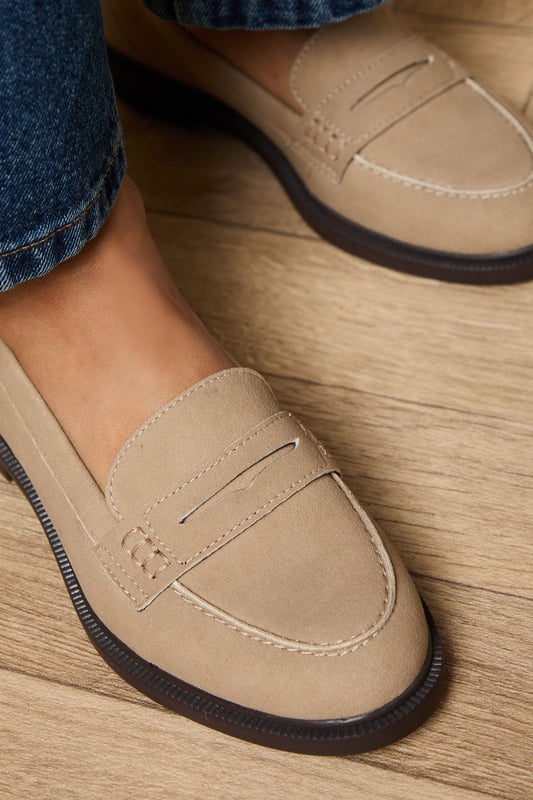 Classic penny loafer design with a contemporary faux suede finish
        Comfortable flat heel measuring between 0-2cm for all-day wearability
        Contrast stitching detail adds subtle visual interest
        Durable synthetic outsole provides reliable grip and longevity
        Versatile slip-on style with traditional penny slot detailing
    
    These Beech Faux Suede Penny Loafers from Oasis offer the perfect blend of timeless style and modern comfort. Pair them with wide-leg denim and an oversized white shirt for an effortlessly chic daytime look, or style with tailored trousers and a blouse for more polished occasions. The neutral tone makes these loafers incredibly versatile, working beautifully with floral dresses and skirts for a feminine touch that's quintessentially Oasis. Their flat design ensures comfort during family gatherings or weekend brunches, whilst the classic penny loafer silhouette adds a sophisticated element to casual ensembles. These shoes transition seamlessly from office to weekend, making them a wardrobe essential that will complement your existing collection whilst adding a refined finishing touch to any outfit.