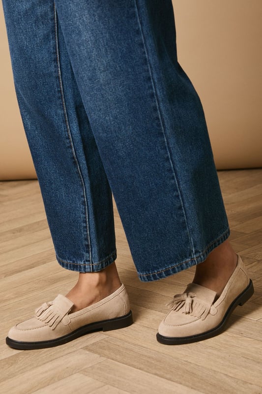 Crafted with soft suede material for everyday comfort
        Decorative tassel detail adds a playful feminine touch
        Classic loafer silhouette with a modern twist
        Flat heel height (under 2cm) ensures all-day wearability
        Durable synthetic outsole provides reliable grip
    
    The Brighton Suede Tassel Loafers from Oasis present the perfect blend of comfort and style for your casual wardrobe. These charming flats showcase delightful tassel detailing that brings character to any ensemble. Style them as seen with relaxed denim jeans and a crisp button-down shirt for an effortlessly chic daytime look. The versatile design makes these loafers ideal for family gatherings, weekend brunches, or casual office environments. Their comfortable flat design ensures you can navigate busy days with ease, whilst the classic silhouette offers timeless appeal that complements both trousers and dresses. Perfect for the woman who values both practicality and feminine details, these loafers will quickly become your go-to footwear for occasions that call for understated elegance with a playful twist.