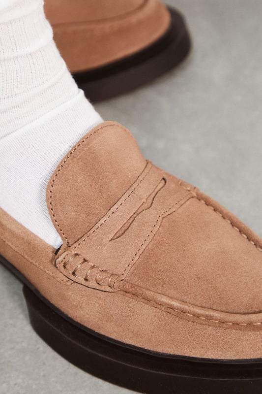 Chunky penny loafer design for a modern twist on a classic style
        Soft suede upper for a luxurious look and feel
        Low heel height between 2.5 and 4.5cm for comfortable all-day wear
        Thick, durable outsole for added stability and longevity
        Versatile regular fit suitable for various foot shapes
    
    Step out in style with these Faith for Warehouse chunky penny loafers, a contemporary take on a timeless silhouette. The suede upper lends a touch of sophistication, while the chunky sole adds a bold, fashion-forward edge. Perfect for casual outings, these loafers effortlessly blend comfort and style. Pair them with cropped trousers and a crisp white shirt for a polished daytime look, or wear them with a flowy midi dress to add a hint of masculine charm to a feminine ensemble. Ideal for family gatherings, weekend brunches, or casual Fridays at the office, these versatile loafers will quickly become a go-to in your wardrobe. The low heel ensures comfort for extended wear, making them suitable for city exploring or long shopping trips. Embrace the fusion of classic design and modern aesthetics with these must-have loafers.