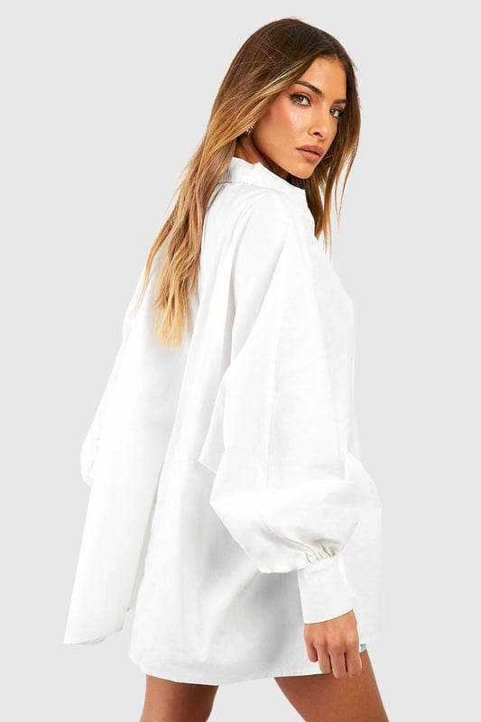 Refresh your wardrobe with this cotton shirt. A true staple, the humble cotton shirt goes with just about everything - and looks good, too! This shirt is made from a lightweight cotton, meaning it's both breathable and easy to wear, and is traditionally tailored with structured sleeves and collar. Dress it up with some wide-leg trousers and heels, or keep things easy-breezy by tucking it into your favourite pair of jeans. Either way, you'll be good to go in this classic shirt.Style: Plain ShirtFabric: Cotton PoplinNeckline: CollaredSleeve Length: Long Sleeve