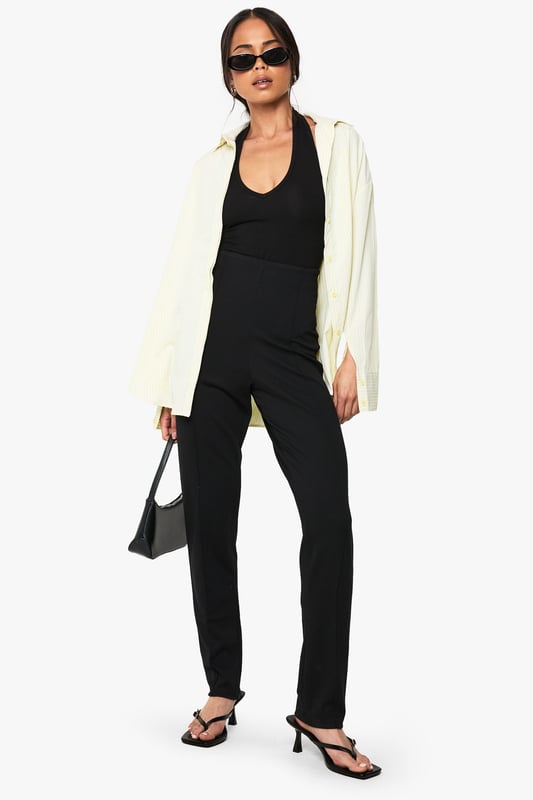 Sleek slim-fit design crafted from ponte fabric for exceptional shape retention
        Streamlined silhouette with clean front seam detailing for a polished look
        Comfortable stretch blend that moves with your body throughout the day
        Versatile mid-rise waistband offering flattering support
        Classic straight-leg cut that pairs effortlessly with both casual and smart attire
    
    These Boohoo slim-fit trousers are the wardrobe essential you've been searching for. The ponte fabric creates a smooth, structured silhouette while maintaining remarkable comfort for all-day wear. Style them as shown with a simple black top and strappy heels for evening drinks, or dress them down with trainers and an oversized blazer for daytime chic. The versatile design transitions seamlessly from office to weekend brunch, making them ideal for the fashion-forward woman who values both style and practicality. For casual gatherings, pair with a relaxed tee and denim jacket, or elevate your look with a silky blouse and statement jewellery for family celebrations. These trousers offer the perfect balance of comfort and sophistication, ensuring they'll quickly become your go-to piece for countless occasions.