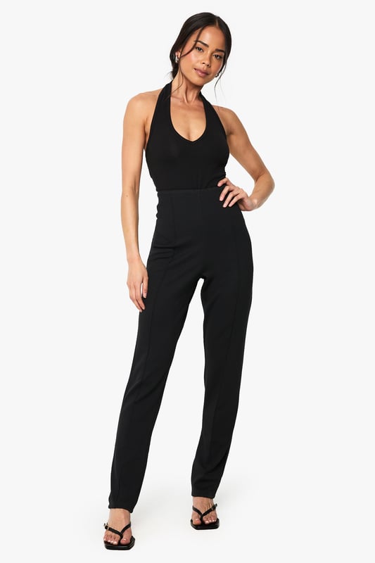 Sleek slim-fit design crafted from ponte fabric for exceptional shape retention
        Streamlined silhouette with clean front seam detailing for a polished look
        Comfortable stretch blend that moves with your body throughout the day
        Versatile mid-rise waistband offering flattering support
        Classic straight-leg cut that pairs effortlessly with both casual and smart attire
    
    These Boohoo slim-fit trousers are the wardrobe essential you've been searching for. The ponte fabric creates a smooth, structured silhouette while maintaining remarkable comfort for all-day wear. Style them as shown with a simple black top and strappy heels for evening drinks, or dress them down with trainers and an oversized blazer for daytime chic. The versatile design transitions seamlessly from office to weekend brunch, making them ideal for the fashion-forward woman who values both style and practicality. For casual gatherings, pair with a relaxed tee and denim jacket, or elevate your look with a silky blouse and statement jewellery for family celebrations. These trousers offer the perfect balance of comfort and sophistication, ensuring they'll quickly become your go-to piece for countless occasions.