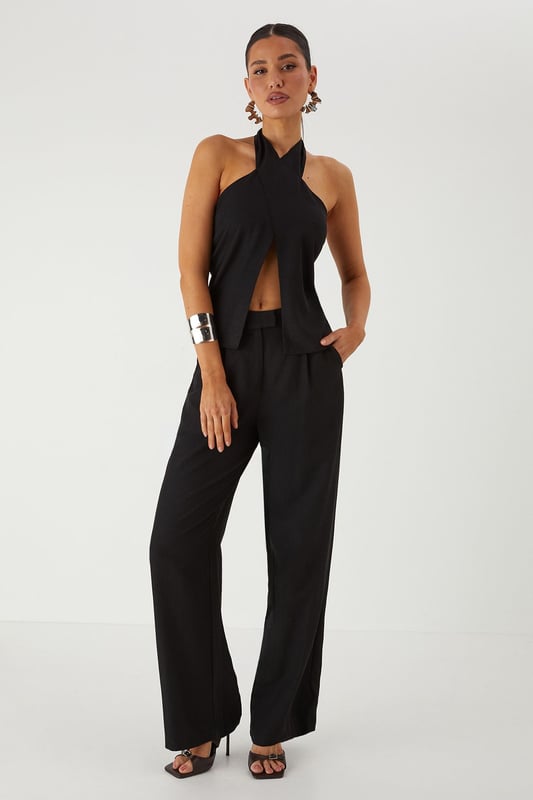 Tailored wide leg design for a dramatic silhouette that commands attention
        Practical side pockets perfect for stashing your essentials on a night out
        High-rise waistband to flatter your figure and provide comfortable all-day wear
        Smooth twill fabric that drapes beautifully with movement
        Versatile design that transitions effortlessly from day to evening events
    
    Make a statement in these MissPap Twill Wide Leg Tailored Trousers, designed to turn heads wherever you go. The dramatic wide leg cut creates a bold silhouette that flows gracefully with every step, whilst the high-rise waistband accentuates your waist for a figure-flattering effect. Style with a cross-halter top as shown for a night on the town, or dress down with a fitted tee and trainers for daytime chic. These trousers work brilliantly for family gatherings when paired with a soft blouse and flat sandals, or amp up the drama for evening drinks with strappy heels and statement jewellery. The side pockets add practical functionality to this fashion-forward piece, making these trousers the perfect addition to your wardrobe for those who want to showcase their confident style whilst maintaining comfort.
