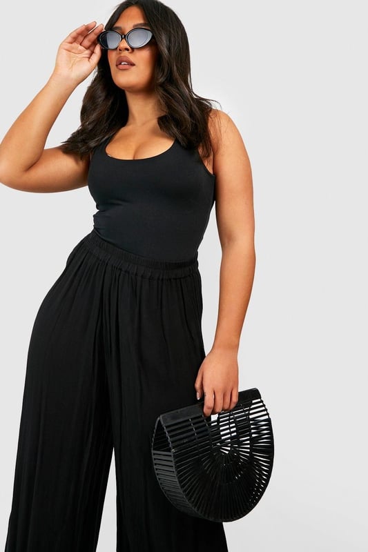 From top to bottom, we've got you covered with this season's perfect pair of plus size trousers. Figure flattering, practical, and an essential addition to your new-season wardrobe, this style is made with extra fabric to ensure the perfect fit. Team a pair of plus size wide leg trousers with a lace bodysuit and barely-there heels for style too good to go unnoticed. It doesn't matter if you're after simple or statement, our dedicated range of plus size pants has the key garms you need.Style: Wide Leg TrousersFabric: Cheesecloth