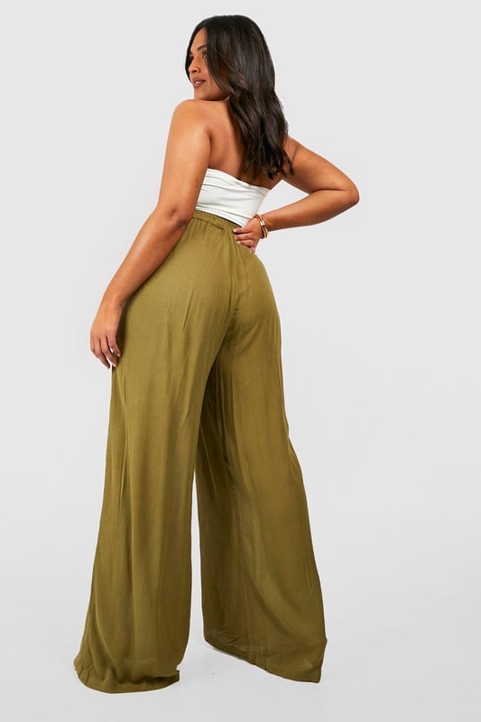 From top to bottom, we've got you covered with this season's perfect pair of plus size trousers. Figure flattering, practical, and an essential addition to your new-season wardrobe, this style is made with extra fabric to ensure the perfect fit. Team a pair of plus size wide leg trousers with a lace bodysuit and barely-there heels for style too good to go unnoticed. It doesn't matter if you're after simple or statement, our dedicated range of plus size pants has the key garms you need.Style: Wide Leg TrousersFabric: Cheesecloth