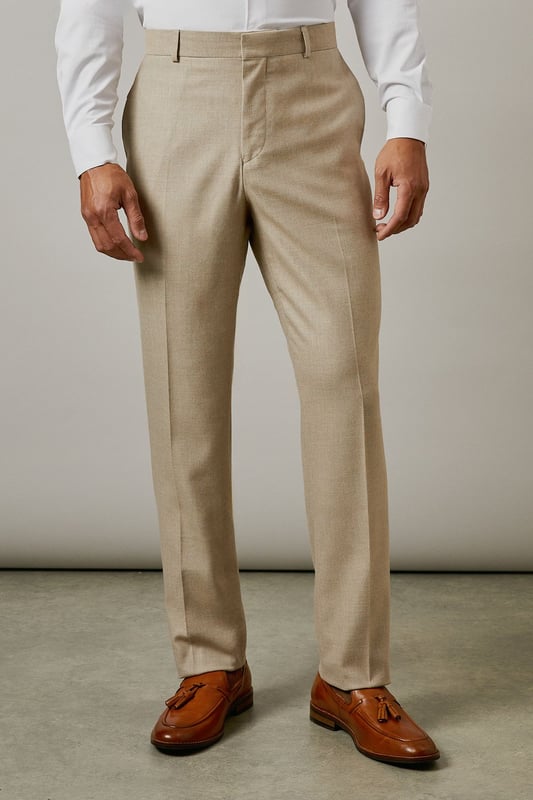 Slim fit design with a tailored silhouette that defines the leg without restricting movement
        Textured woven fabric adds subtle dimension and visual interest to your formal attire
        Classic flat front styling for a clean, contemporary appearance
        Functional side pockets and button-fastened back pockets for practicality
        Versatile neutral tone that pairs effortlessly with various shirt and jacket combinations
    
    These textured slim fit trousers from Burton deliver refined style with modern sensibility. The tailored cut creates a sharp silhouette that's ideal for the gentleman who appreciates classic styling with contemporary proportions. Perfect for work-to-weekend versatility, pair them with the matching jacket for formal occasions or team with a crisp white shirt as shown for smart-casual events. The textured fabric adds character whilst maintaining a sophisticated appearance that works brilliantly for important meetings or social gatherings. These trousers coordinate seamlessly with brown leather brogues and a complementary belt for a polished finish. An essential addition to any discerning wardrobe, these trousers will become your go-to choice for everything from business meetings to sophisticated evening events at your local gastropub.
