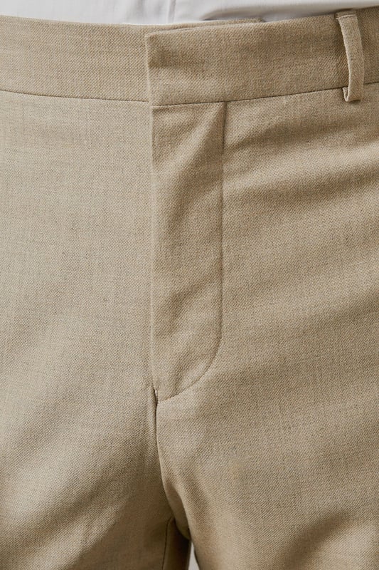 Slim fit design with a tailored silhouette that defines the leg without restricting movement
        Textured woven fabric adds subtle dimension and visual interest to your formal attire
        Classic flat front styling for a clean, contemporary appearance
        Functional side pockets and button-fastened back pockets for practicality
        Versatile neutral tone that pairs effortlessly with various shirt and jacket combinations
    
    These textured slim fit trousers from Burton deliver refined style with modern sensibility. The tailored cut creates a sharp silhouette that's ideal for the gentleman who appreciates classic styling with contemporary proportions. Perfect for work-to-weekend versatility, pair them with the matching jacket for formal occasions or team with a crisp white shirt as shown for smart-casual events. The textured fabric adds character whilst maintaining a sophisticated appearance that works brilliantly for important meetings or social gatherings. These trousers coordinate seamlessly with brown leather brogues and a complementary belt for a polished finish. An essential addition to any discerning wardrobe, these trousers will become your go-to choice for everything from business meetings to sophisticated evening events at your local gastropub.