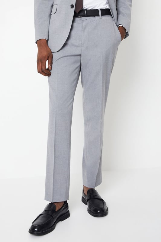 Introducing our Essential Tailored Fit Smart trousers, a must-have addition to your wardrobe. These trousers features a zip fly fastening for convenience and is designed to provide a sleek and polished look. Made with a polyester viscose blend with added stretch ensures a cool and comfortable fit all day long. Pair these versatile trousers with matching items, perfect for any smart occasion.