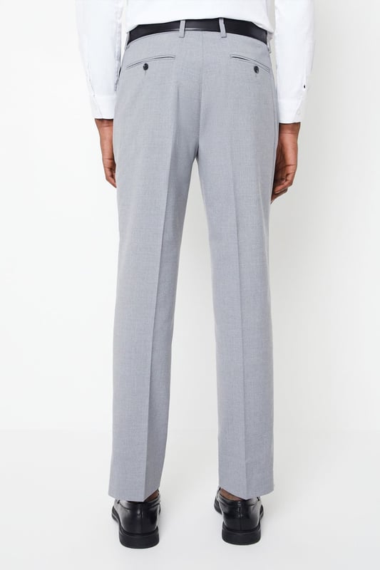 Introducing our Essential Tailored Fit Smart trousers, a must-have addition to your wardrobe. These trousers features a zip fly fastening for convenience and is designed to provide a sleek and polished look. Made with a polyester viscose blend with added stretch ensures a cool and comfortable fit all day long. Pair these versatile trousers with matching items, perfect for any smart occasion.
