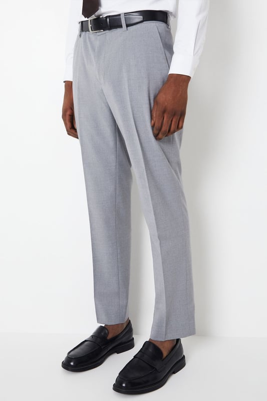 Introducing our Essential Tailored Fit Smart trousers, a must-have addition to your wardrobe. These trousers features a zip fly fastening for convenience and is designed to provide a sleek and polished look. Made with a polyester viscose blend with added stretch ensures a cool and comfortable fit all day long. Pair these versatile trousers with matching items, perfect for any smart occasion.