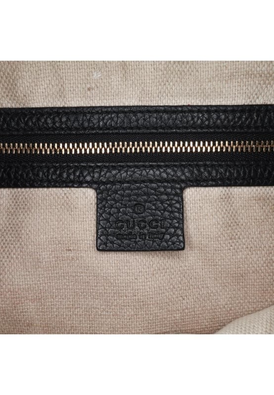 The Soho satchel features a leather body a tassel detail a flat top handle a detachable flat leather shoulder strap a top zip closure and interior zip and slip pockets.Brand: GucciCondition: Pre-lovedType: SatchelRating: B+Main Material: LeatherDimensions (LxWxD): 31x33x13Strap Drop: 45Handle Drop: 21Dust Bag: YesComments: Exterior Back Creased. Exterior Bottom Scratched. Exterior Corners Worn. Exterior Front Worn. Exterior Handle Cracked. Interior Pocket stained with Other. Interior Lining Worn. Interior Lining stained with Pen Mark Other. Practical Attachment Scratched. Exterior Top Worn.