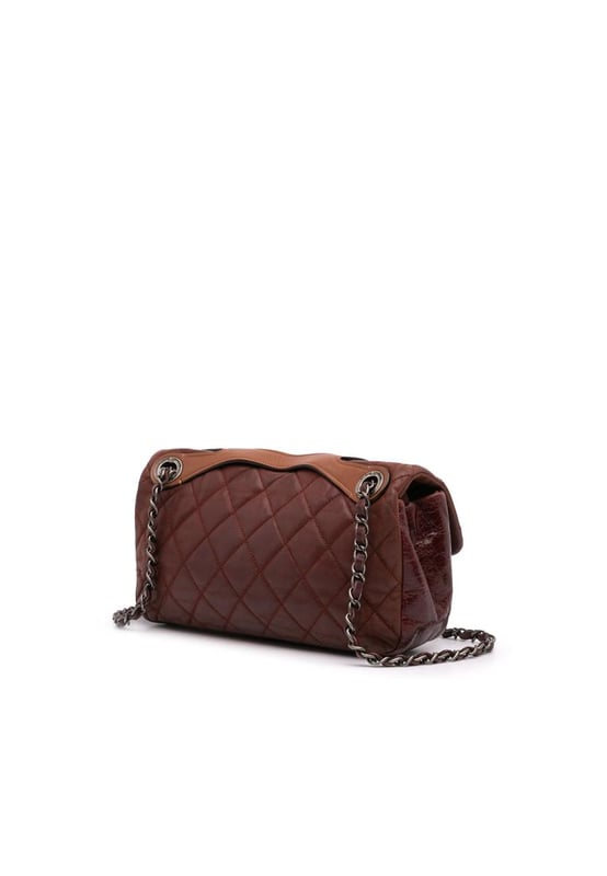 This satchel features a quilted lambskin leather body a flat leather top handle a leather woven chain link strap a front flap with CC turn lock closure and an interior zip pocket.Brand: ChanelCondition: Pre-lovedType: SatchelRating: B+Main Material: LeatherDimensions (LxWxD): 15x26.5x8Strap Drop: 28.5Comments: Lock Scratched. Exterior Handle Worn. Interior Lining stained with Other. Practical Attachment Scratched. Exterior Side Cracked Worn. Item has an odor of Other.