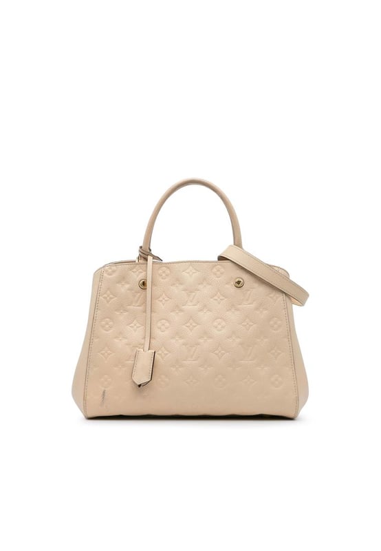 The Montaigne MM features a monogram empreinte leather body rolled leather handles a detachable flat leather strap an open top with lobster claw closure and interior zip and slip pockets.Brand: Louis VuittonCondition: Pre-lovedType: SatchelRating: B+Main Material: LeatherDimensions (LxWxD): 23x34x12Strap Drop: 37Handle Drop: 12.5Comments: Exterior Back Scratched Worn. Exterior Corners Worn. Embellishment Scratched. Exterior Front Worn. Exterior Handle Worn. Interior Lining Worn. Zipper Scratched.