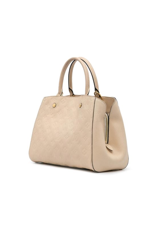 The Montaigne MM features a monogram empreinte leather body rolled leather handles a detachable flat leather strap an open top with lobster claw closure and interior zip and slip pockets.Brand: Louis VuittonCondition: Pre-lovedType: SatchelRating: B+Main Material: LeatherDimensions (LxWxD): 23x34x12Strap Drop: 37Handle Drop: 12.5Comments: Exterior Back Scratched Worn. Exterior Corners Worn. Embellishment Scratched. Exterior Front Worn. Exterior Handle Worn. Interior Lining Worn. Zipper Scratched.