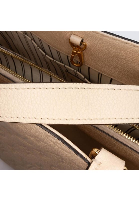 The Montaigne MM features a monogram empreinte leather body rolled leather handles a detachable flat leather strap an open top with lobster claw closure and interior zip and slip pockets.Brand: Louis VuittonCondition: Pre-lovedType: SatchelRating: B+Main Material: LeatherDimensions (LxWxD): 23x34x12Strap Drop: 37Handle Drop: 12.5Comments: Exterior Back Scratched Worn. Exterior Corners Worn. Embellishment Scratched. Exterior Front Worn. Exterior Handle Worn. Interior Lining Worn. Zipper Scratched.