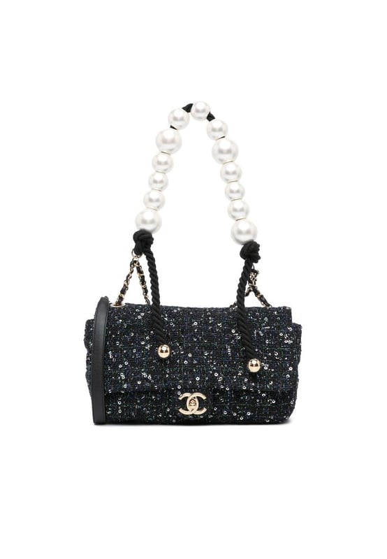 This flap bag features a tweed body with sequin details a faux pearl handle a leather woven chain shoulder strap with leather guard a front flap with interlocking Cs and twist lock closure and an interior zip pocket.Brand: ChanelCondition: Pre-lovedType: SatchelRating: B+Main Material: fabricDimensions (LxWxD): 16x23x7Strap Drop: 52Handle Drop: 20Comments: Exterior Back Creased Worn. Exterior Bottom Worn. Lock Scratched. Exterior Corners Worn. Embellishment Scratched. Exterior Front Loose Stitching Worn. Exterior Handle Worn. Interior Pocket Worn. Interior Lining Scratched Worn. Practical Attachment Scratched. Exterior Side Worn. Exterior Top Worn. Zipper Scratched.