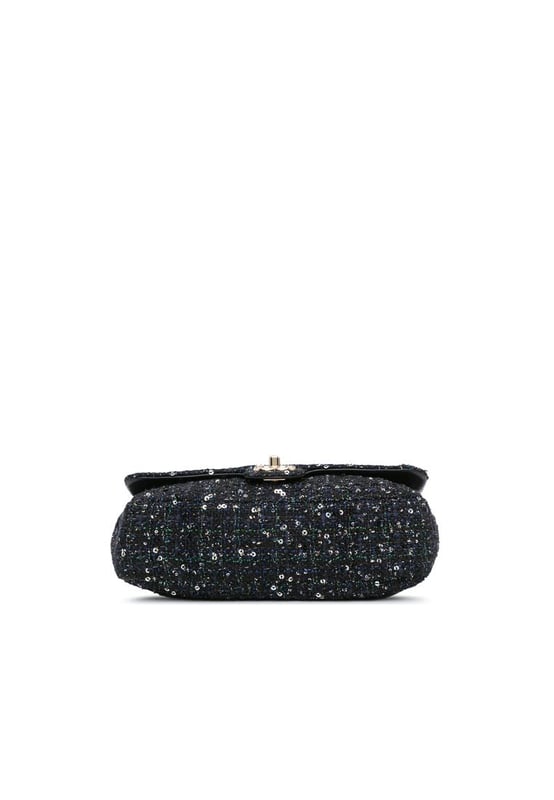 This flap bag features a tweed body with sequin details a faux pearl handle a leather woven chain shoulder strap with leather guard a front flap with interlocking Cs and twist lock closure and an interior zip pocket.Brand: ChanelCondition: Pre-lovedType: SatchelRating: B+Main Material: fabricDimensions (LxWxD): 16x23x7Strap Drop: 52Handle Drop: 20Comments: Exterior Back Creased Worn. Exterior Bottom Worn. Lock Scratched. Exterior Corners Worn. Embellishment Scratched. Exterior Front Loose Stitching Worn. Exterior Handle Worn. Interior Pocket Worn. Interior Lining Scratched Worn. Practical Attachment Scratched. Exterior Side Worn. Exterior Top Worn. Zipper Scratched.