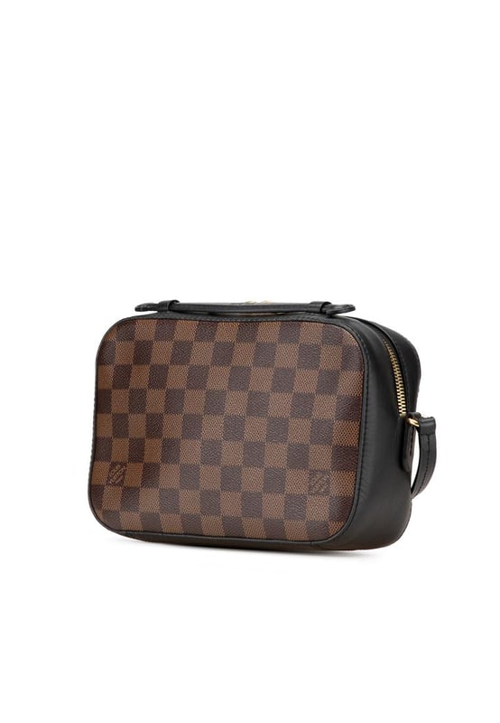 The Santa Monica features a damier ebene canvas body with leather trim a flat leather top handle a detachable flat leather strap a top zip closure and an interior slip pocket.Brand: Louis VuittonCondition: Pre-lovedType: SatchelRating: B+Main Material: CanvasDimensions (LxWxD): 14.5x21x7Strap Drop: 56Comments: Exterior Bottom Scratched. Exterior Corners Worn. Exterior Handle Creased Worn. Interior Lining Worn. Interior Lining stained with Other. Practical Attachment Scratched. Exterior Top stained with Other. Zipper Scratched.