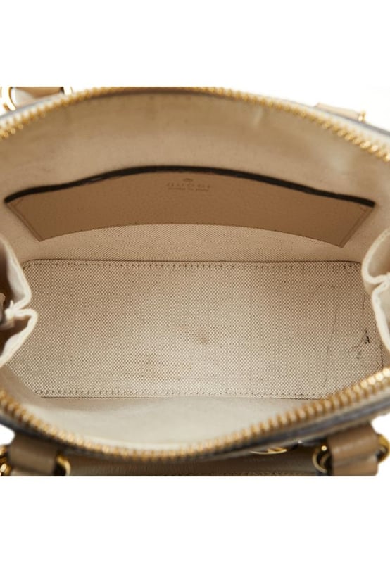 The Horsebit 1955 satchel features a coated canvas body with leather trim rolled leather handles a zip-around closure and interior zip and slip pockets.Brand: GucciCondition: Pre-lovedType: SatchelRating: B+Main Material: FabricDimensions (LxWxD): 17.5x20x7Handle Drop: 8.5Comments: Exterior Back Out Of Shape. Exterior Bottom Out Of Shape. Exterior Corners Worn. Exterior Front Discolored Out Of Shape. Exterior Front stained with Other. Exterior Handle Discolored Out Of Shape Scratched Worn. Interior Pocket stained with Pen Mark Other. Interior Lining Worn. Interior Lining stained with Other. Practical Attachment Scratched. Exterior Side Out Of Shape. Exterior Top Out Of Shape Scratched. Zipper Scratched.