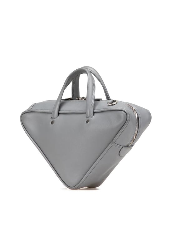The Triangle Duffle bag features a leather body flat leather handles a detachable flat leather strap a top zip closure and an interior zip pocket.Brand: BalenciagaCondition: Pre-lovedType: SatchelRating: B+Main Material: LeatherDimensions (LxWxD): 15x35x8Strap Drop: 61Handle Drop: 9.5Comments: Exterior Back Worn. Exterior Bottom Out Of Shape Worn. Exterior Front Worn. Interior Pocket stained with Other. Interior Lining Scratched. Practical Attachment Scratched. Exterior Side Out Of Shape Worn. Exterior Top Out Of Shape Worn. Exterior Top stained with Other. Zipper Scratched.