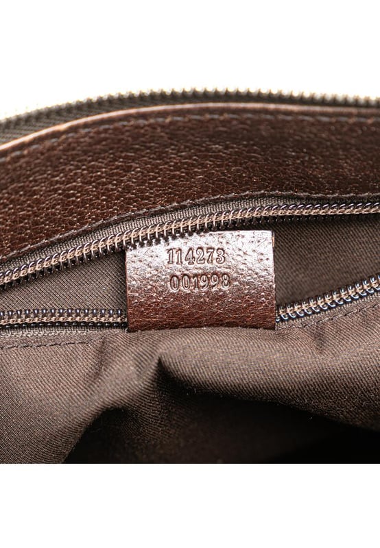 Este bolso cruzado presenta un cuerpo de lona con detalles en cuero, una correa plana ajustable, un cierre superior de cremallera y un bolsillo interior con cremallera. Marca: Gucci Condición: Pre-amado Tipo: Bolso cruzado Clasificación: B+ Material principal: tela Dimensiones (LxWxD): 21.5x27x9 Caída de la correa: 60 Comentarios: Parte trasera exterior manchada con otros. Esquinas exteriores desgastadas. Parte frontal exterior manchada con otros. Asa exterior arrugada y desgastada. Asa exterior manchada con otros. Bolsillo interior manchado con otros. Forro interior desgastado. Forro interior manchado con otros. Accesorio práctico rallado. Lado exterior manchado con otros. Parte superior exterior manchada con otros. Cremallera rallada.