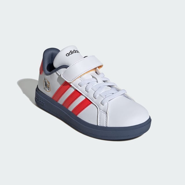 Wherever kids go, their Disney favourites go with them. These kids' adidas sneakers bring a little magic to play dates, park trips and more. The lightweight upper is lined for comfort while the flexible rubber outsole stands up to daily wear. Stretchy laces make for easy on and off, so nothing gets in the way of the fun.  - Regular fit - Elastic laces with hook-and-loop top strap - Synthetic upper - Textile lining - Disney's Mickey and Friends graphics - Rubber outsole - ©Disney  Shipped by adidas