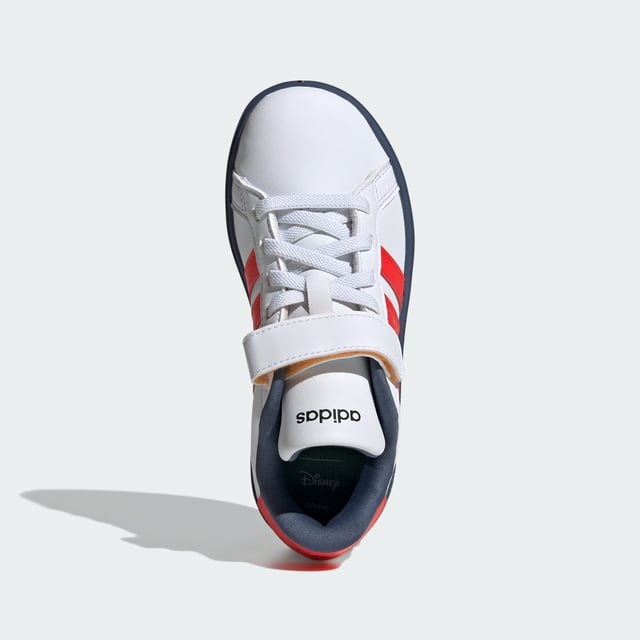 Wherever kids go, their Disney favourites go with them. These kids' adidas sneakers bring a little magic to play dates, park trips and more. The lightweight upper is lined for comfort while the flexible rubber outsole stands up to daily wear. Stretchy laces make for easy on and off, so nothing gets in the way of the fun.  - Regular fit - Elastic laces with hook-and-loop top strap - Synthetic upper - Textile lining - Disney's Mickey and Friends graphics - Rubber outsole - ©Disney  Shipped by adidas