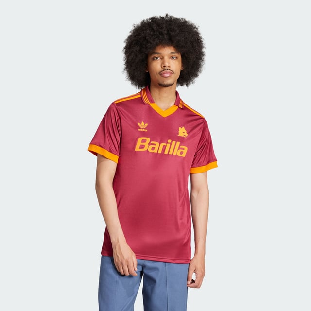 Relive a slice of AS Roma history in this adidas jersey. A faithful recreation of the club's 92/93 shirt, it shows off a simplified badge and flock-printed Trefoil. Whether you're cheering on the Giallorossi at the Stadio Olimpico or showing your club spirit around town, its relaxed fit will keep you comfortable in quintessential '90s football style.This product is made with 100% recycled materials. By reusing materials that have already been created, adidas help to reduce waste and our reliance on finite resources and reduce the footprint of the products adidas make.  - Loose fit - V-neck - 100% polyester (recycled) - AS Roma embroidered crest  Shipped by adidas