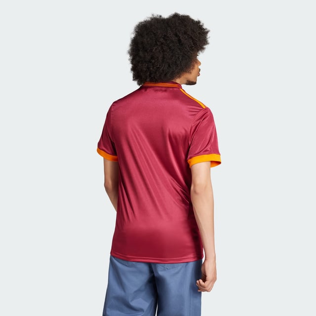 Relive a slice of AS Roma history in this adidas jersey. A faithful recreation of the club's 92/93 shirt, it shows off a simplified badge and flock-printed Trefoil. Whether you're cheering on the Giallorossi at the Stadio Olimpico or showing your club spirit around town, its relaxed fit will keep you comfortable in quintessential '90s football style.This product is made with 100% recycled materials. By reusing materials that have already been created, adidas help to reduce waste and our reliance on finite resources and reduce the footprint of the products adidas make.  - Loose fit - V-neck - 100% polyester (recycled) - AS Roma embroidered crest  Shipped by adidas