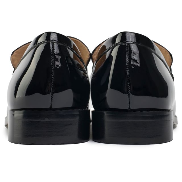 A statement piece crafted from premium high-shine patent leather. This sophisticated loafer by Holland Cooper is adorned with iconic gold hardware over the toe for a distinctive and luxurious touch. Perfect for elevating any outfit, the Abbot Loafer seamlessly blends timeless design with bold branding, making it a must-have addition to your footwear collection.