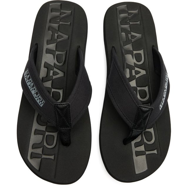 The Napapijri Elm delivers effortless summer style in sleek black. These contemporary flip flops combine durability with comfort, featuring reinforced nylon upper straps that withstand beach-to-bar transitions. The microporous EVA sole provides exceptional cushioning for all-day wear, while maintaining a lightweight feel. Perfect for casual outings or poolside lounging, these sandals embody Napapijri's signature blend of practical design and understated elegance. An essential addition to your warm-weather wardrobe.