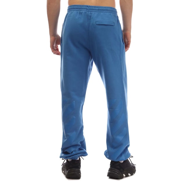 Off White Diagonal Tab Slim Sweatpants in blauw.- Elastische tailleband met trekkoord.- Zijzakken.- Off-White™ logo op de voorkant gedrukt.- Diagonaalprints aan de zijkant.- Enkelmanchetten.- 100% Katoen.- Ref: OMCH0290014545