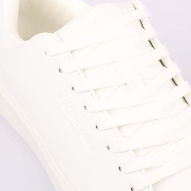 Duck and Cover Kremes Trainers in white.- PU leather upper.- Lace up fastening.- Thick flat laces.- Branded tongue label.- Embossed side branding.- Durable sole.- Ref: DC2V124729WHT