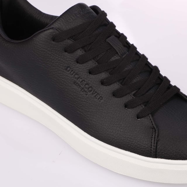 Duck and Cover Kremes Trainers in black.- PU leather upper.- Lace up fastening.- Thick flat laces.- Branded tongue label.- Embossed side branding.- Durable sole.- Ref: DC2V124729BLK